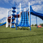 Blue playground equipment installed on artificial grass