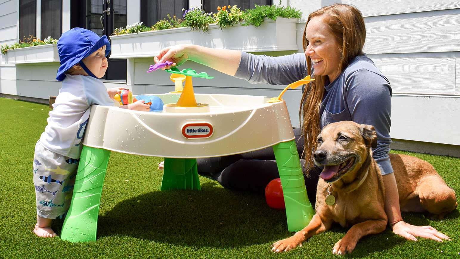 Family playing on artificial grass