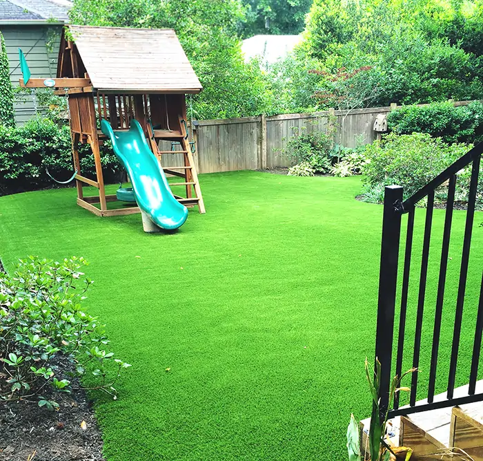 Backyard artificial grass playground installed by SYNLawn